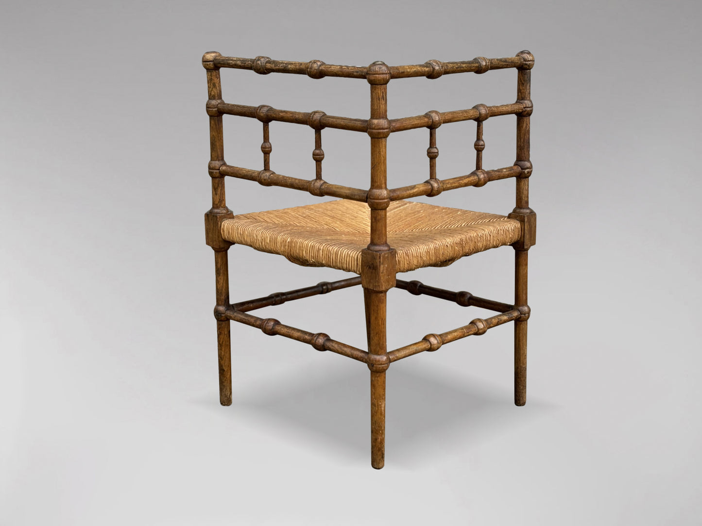20TH CENTURY FRENCH OAK BOBBIN CORNER CHAIR, CIRCA 1920