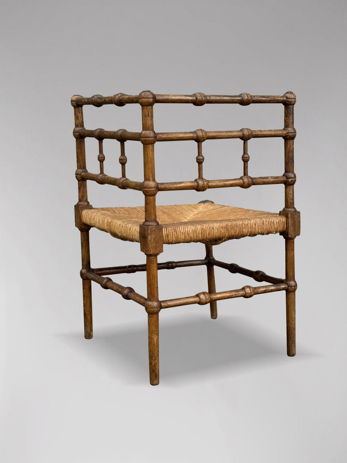 20TH CENTURY FRENCH OAK BOBBIN CORNER CHAIR, CIRCA 1920