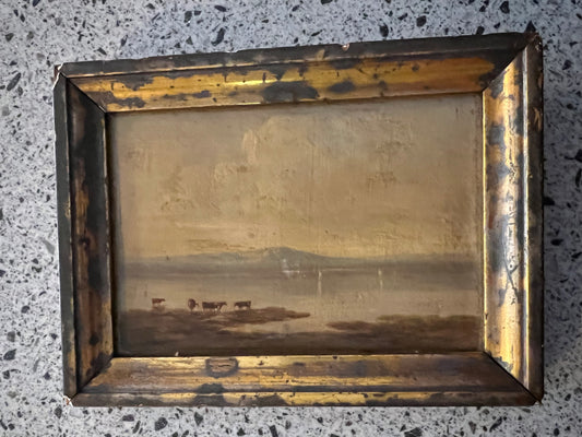 Bovini delle Highland presso un lago