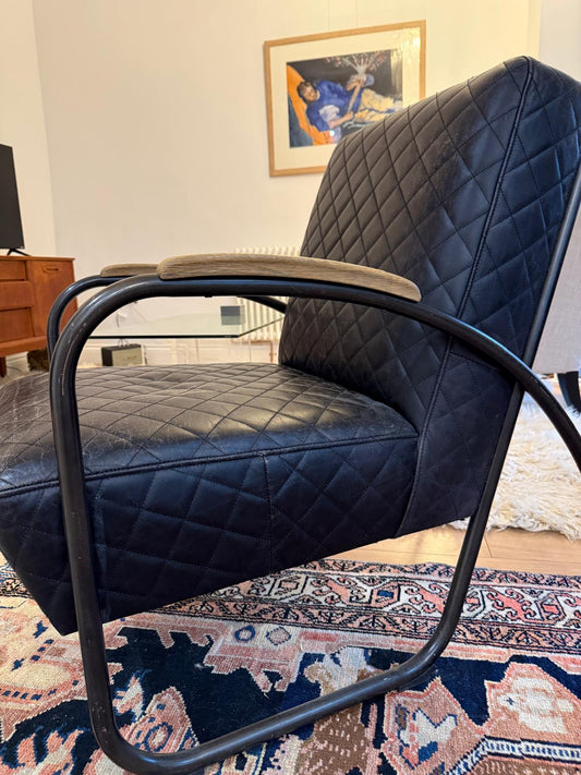 Andrew Martin Black Leather Quilted Bent Metal Arm Chair