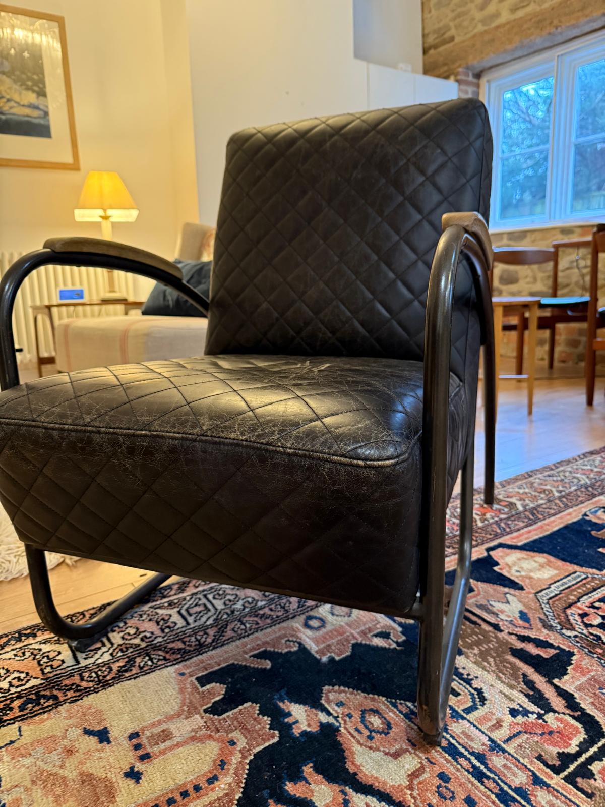 Andrew Martin Black Leather Quilted Bent Metal Arm Chair