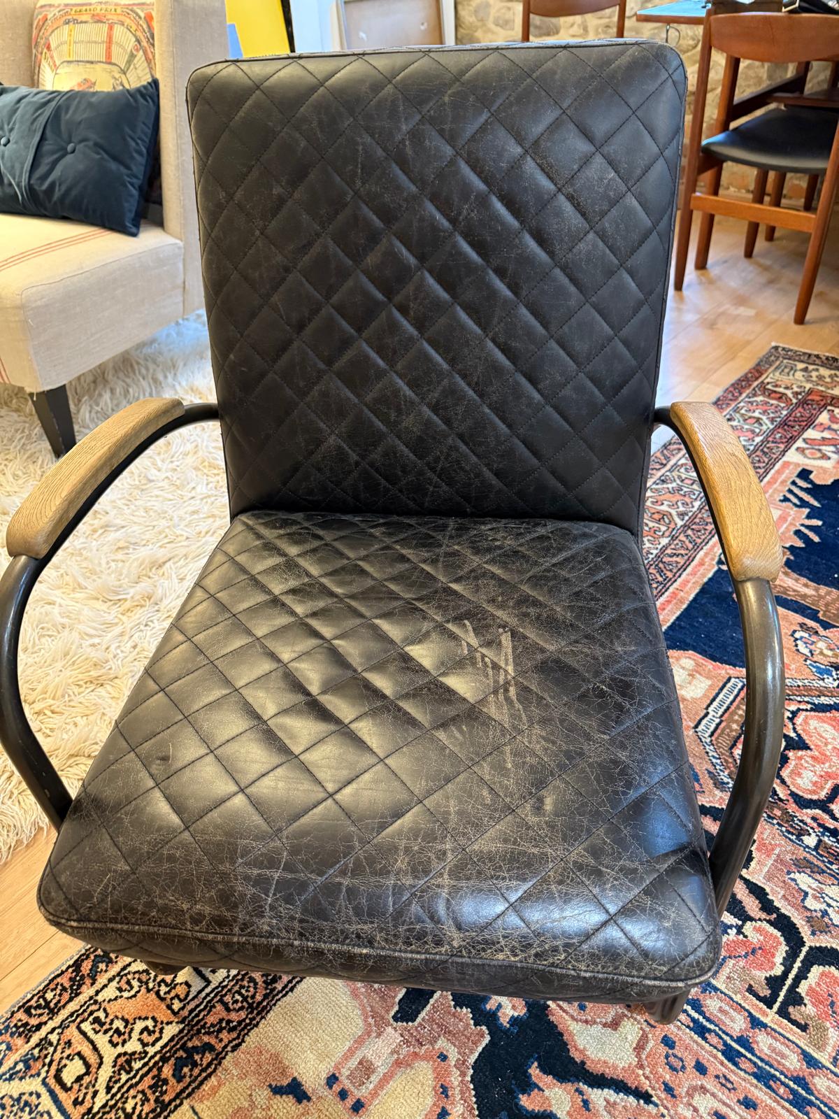 Andrew Martin Black Leather Quilted Bent Metal Arm Chair